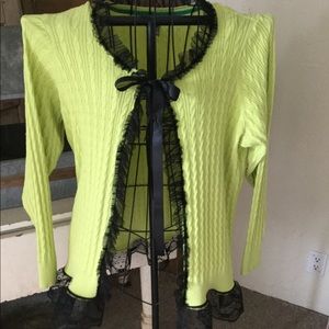 Lime green sweater with black trim.